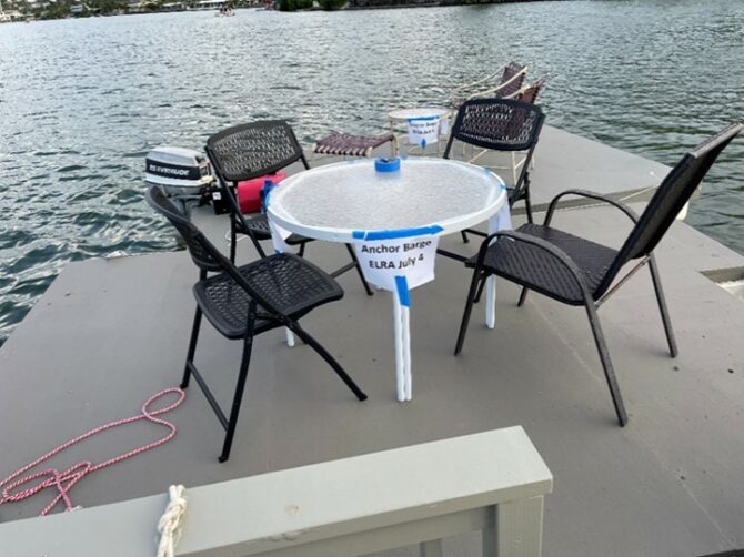 Chairs and table on a foating barge.